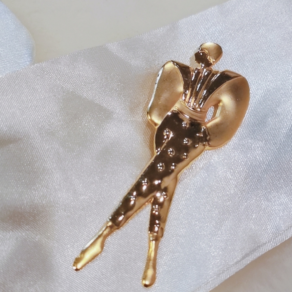 Figure brooch